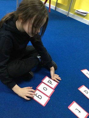 Pupil using letter cards